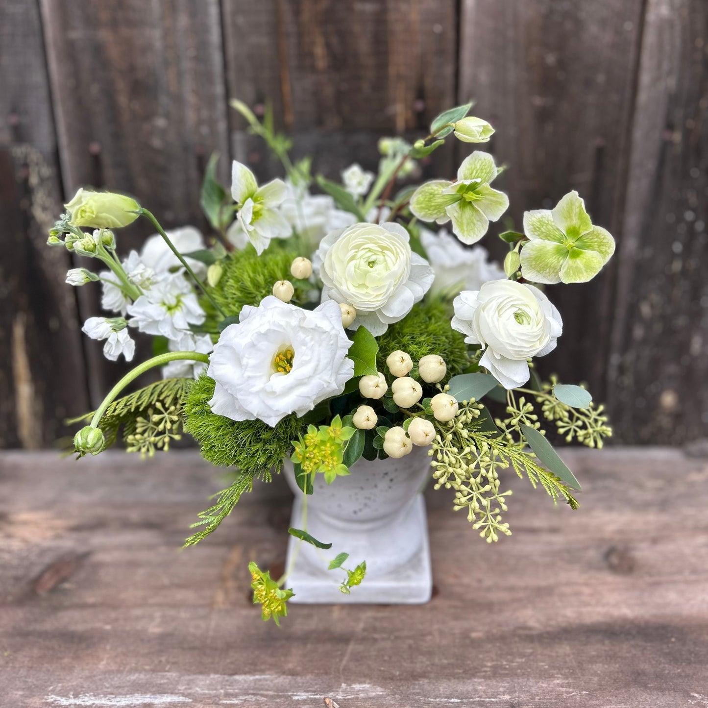 Bouquet of white and green flowers in a vase